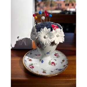 Vintage Floral Egg Cup Pin Cushion with Floral embellishments.
